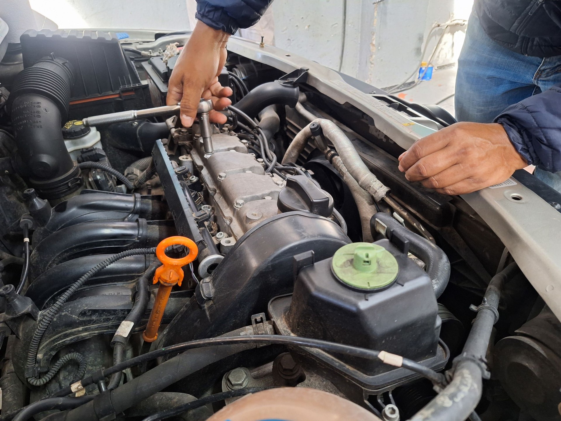 a man closing the engine of a car