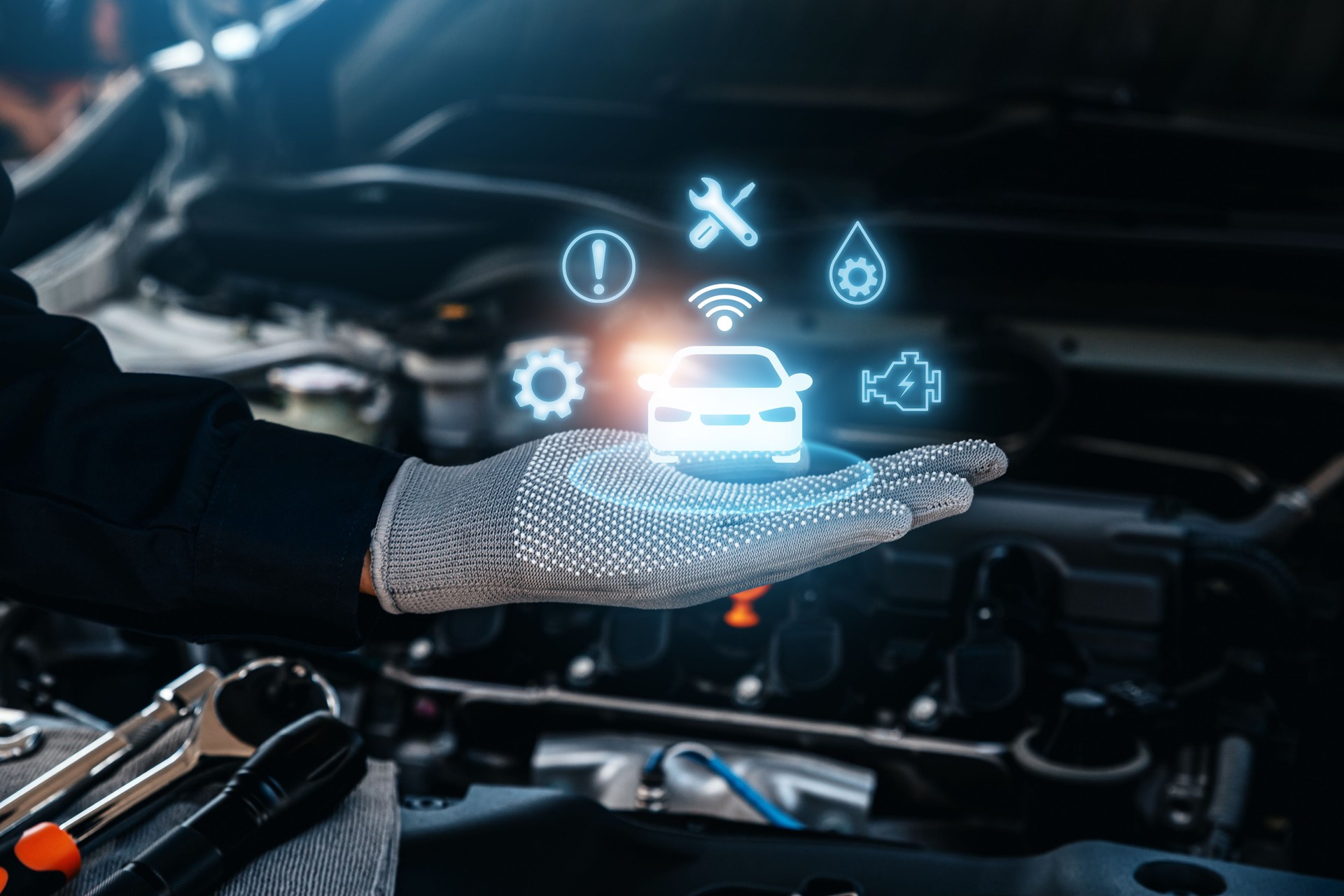 Hand of mechanic holding intelligent vehicle.